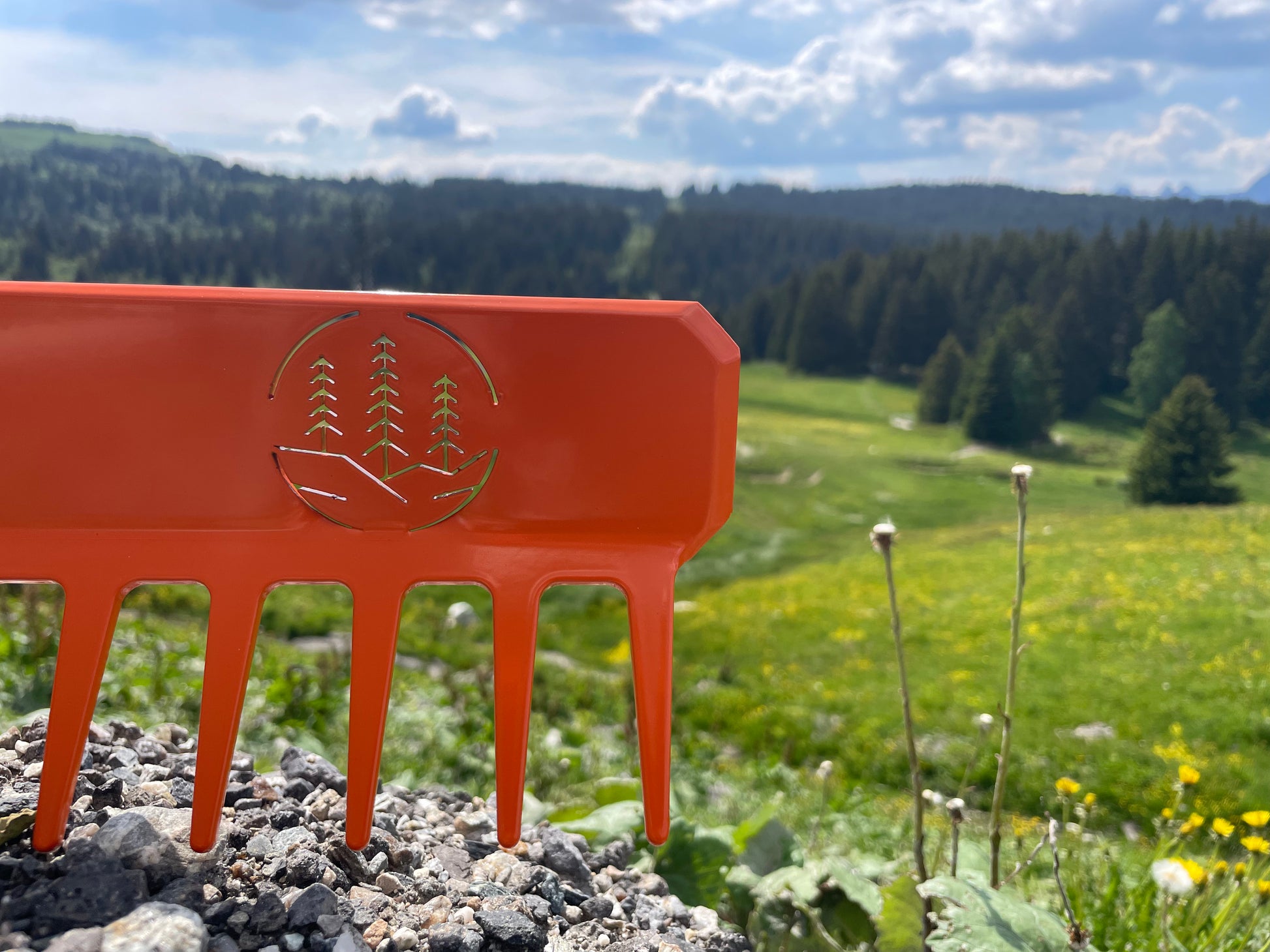 R'TOOL Finish'R trail building rake on alpine mountain landscape