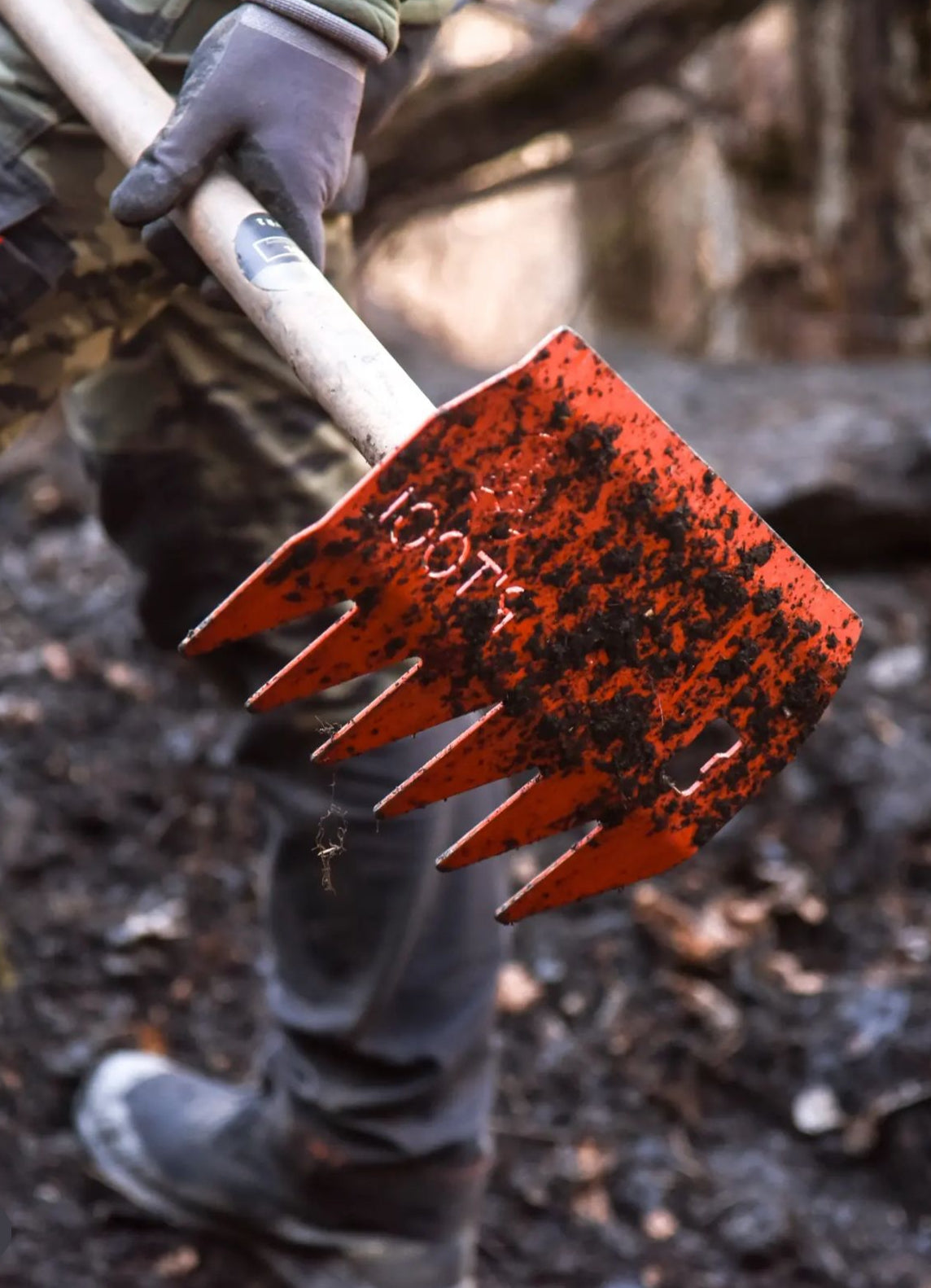 R'TOOL Shape'R 2 trail building rake covered in dirt during MTB trail shaping work