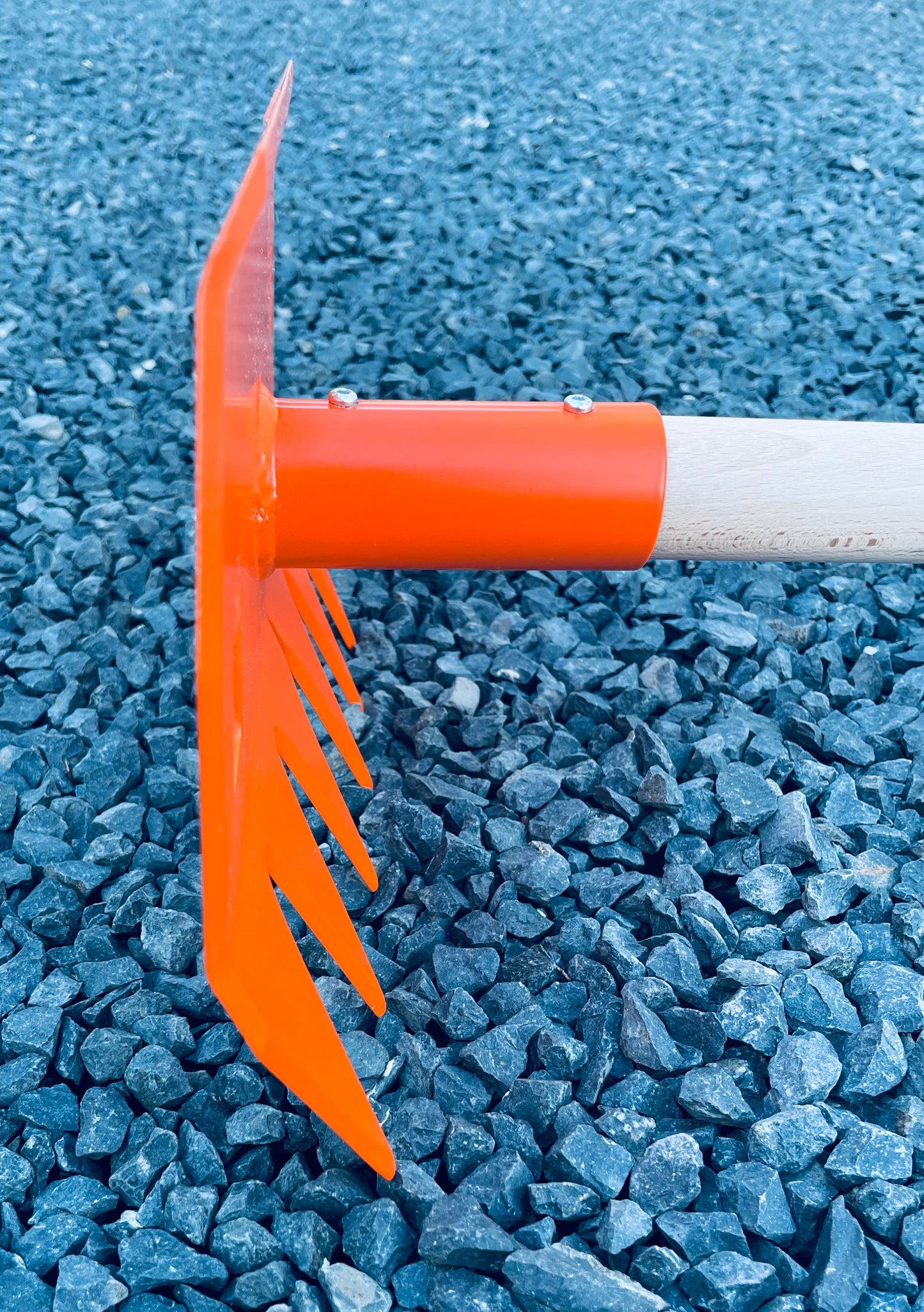 Profile view of R'TOOL Shape'R 2 trail building rake showing steel head and wooden handle