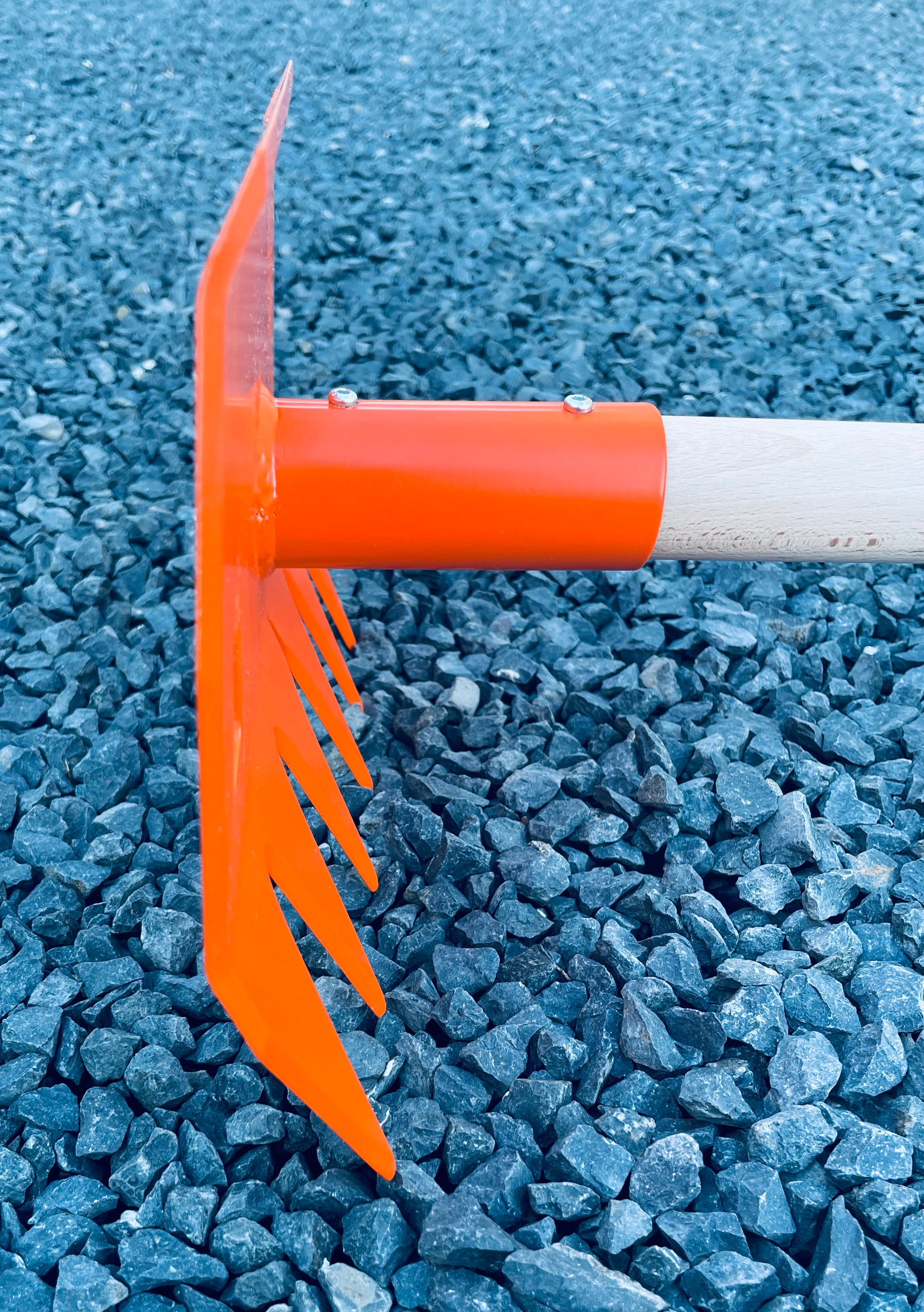 Profile view of R'TOOL Shape'R 2 trail building rake showing steel head and wooden handle
